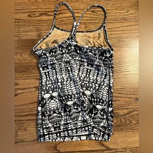 Black and white Lulu lemon razor back workout tank size 2 w/ built in spots bra.